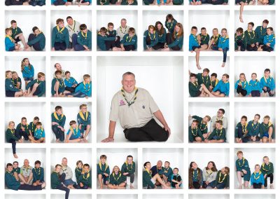 Sutton Scouts 50th Celebration Leader surrounded by 100 scouts Wirral family photographer